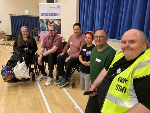 6 Lived Experience Ambassadors smiling at the camera.