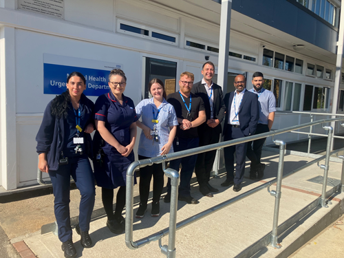 7 mental health urgent care team members standing outside a building.