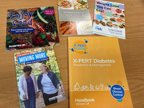 Five books sitting on a table