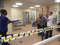 Allied health professionals working with a patient