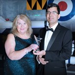 Photo of Dr. Gladvine Mundempilly, Consultant Psychiatrist and Director of Medical Appraisal and Revalidation accepting his award