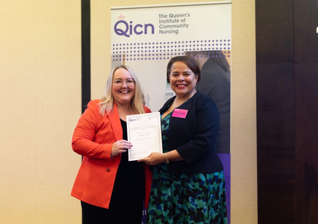 Photo of Clare Vine receiving her award