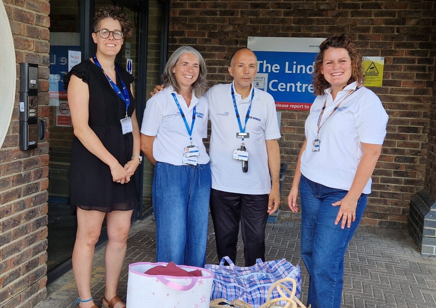 Lucie, Amanda, Rosario and Charlotte with bags of clothes