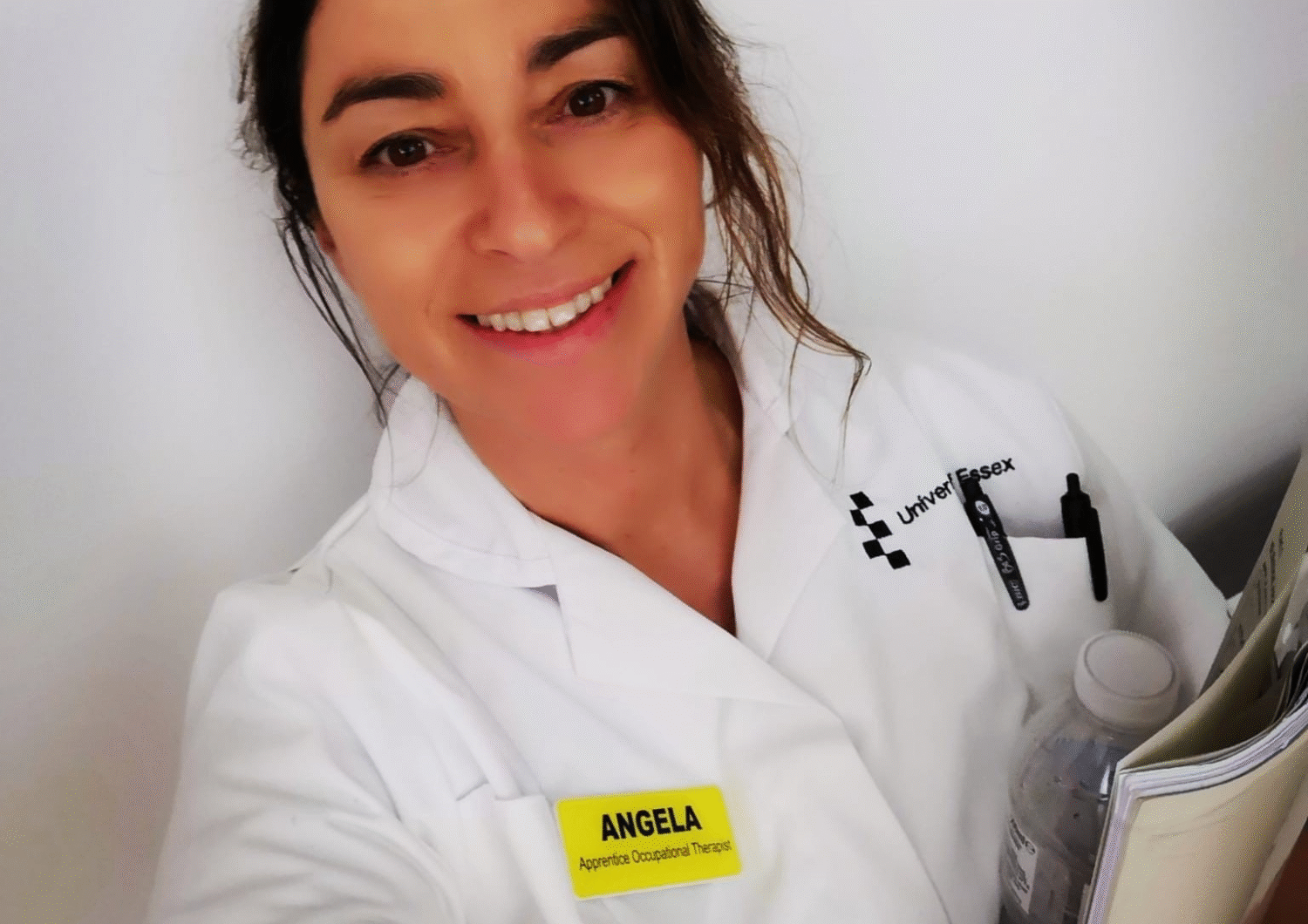 Angela Mole, an apprenticeship Occupational Therapist, smiling in uniform.
