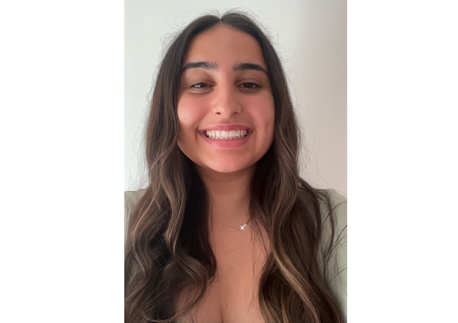 Photo of Holly Deboo smiling at the camera.