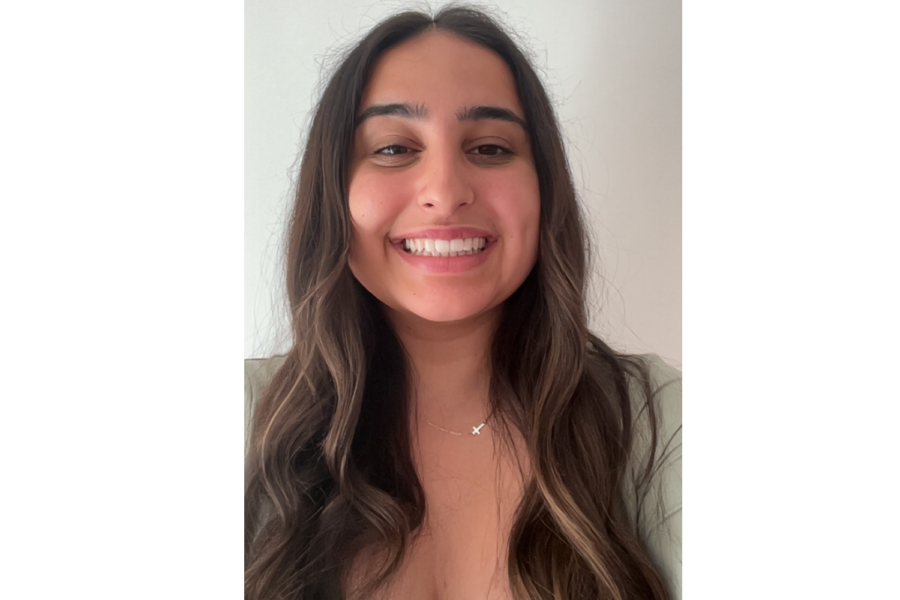 Photo of Holly Deboo smiling at the camera.