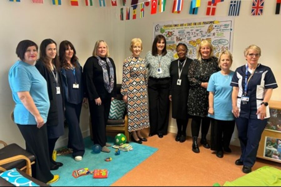 Group of women standing together smiling at the camera