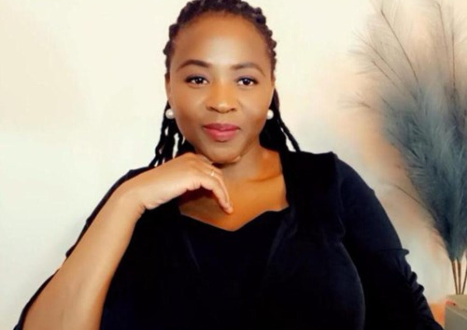 Black woman smiling at the camera