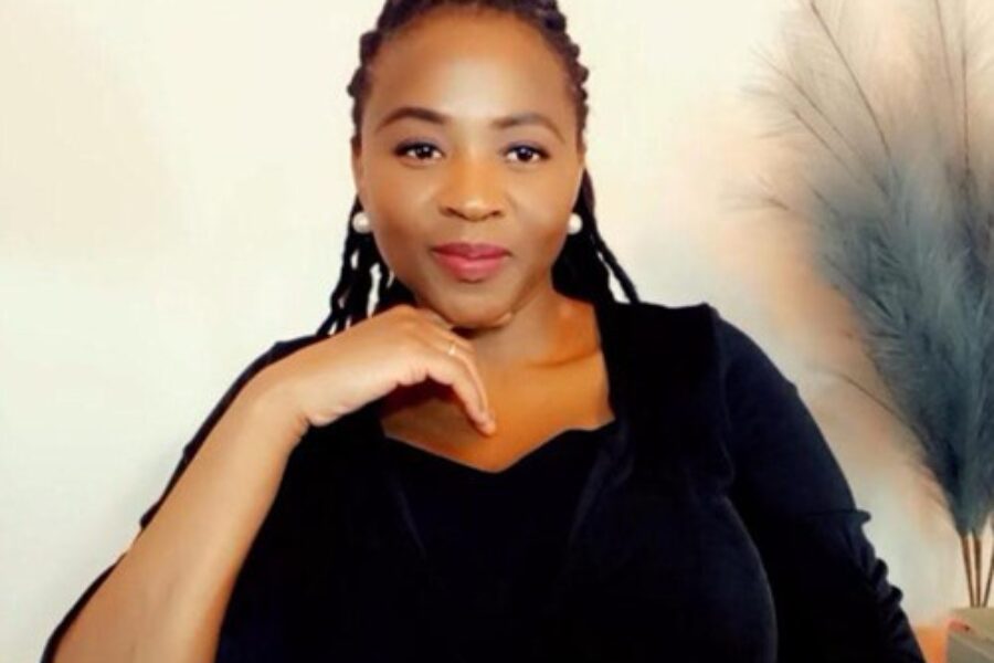 Black woman smiling at the camera