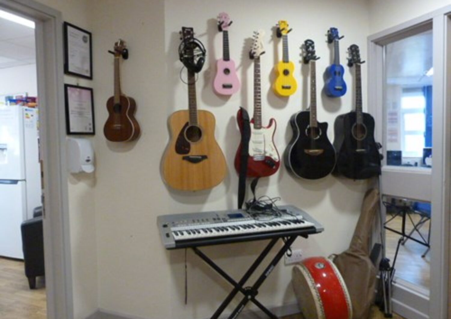 Music room with guitars on the wall and a keyboard