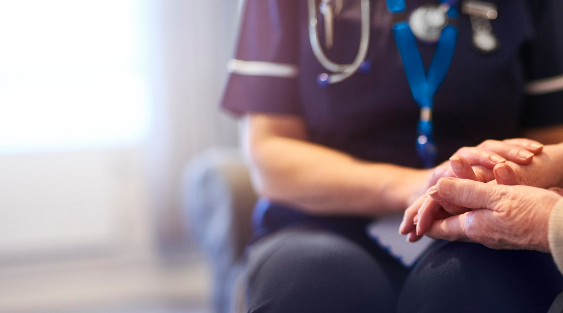 Staff holding hands of a patient