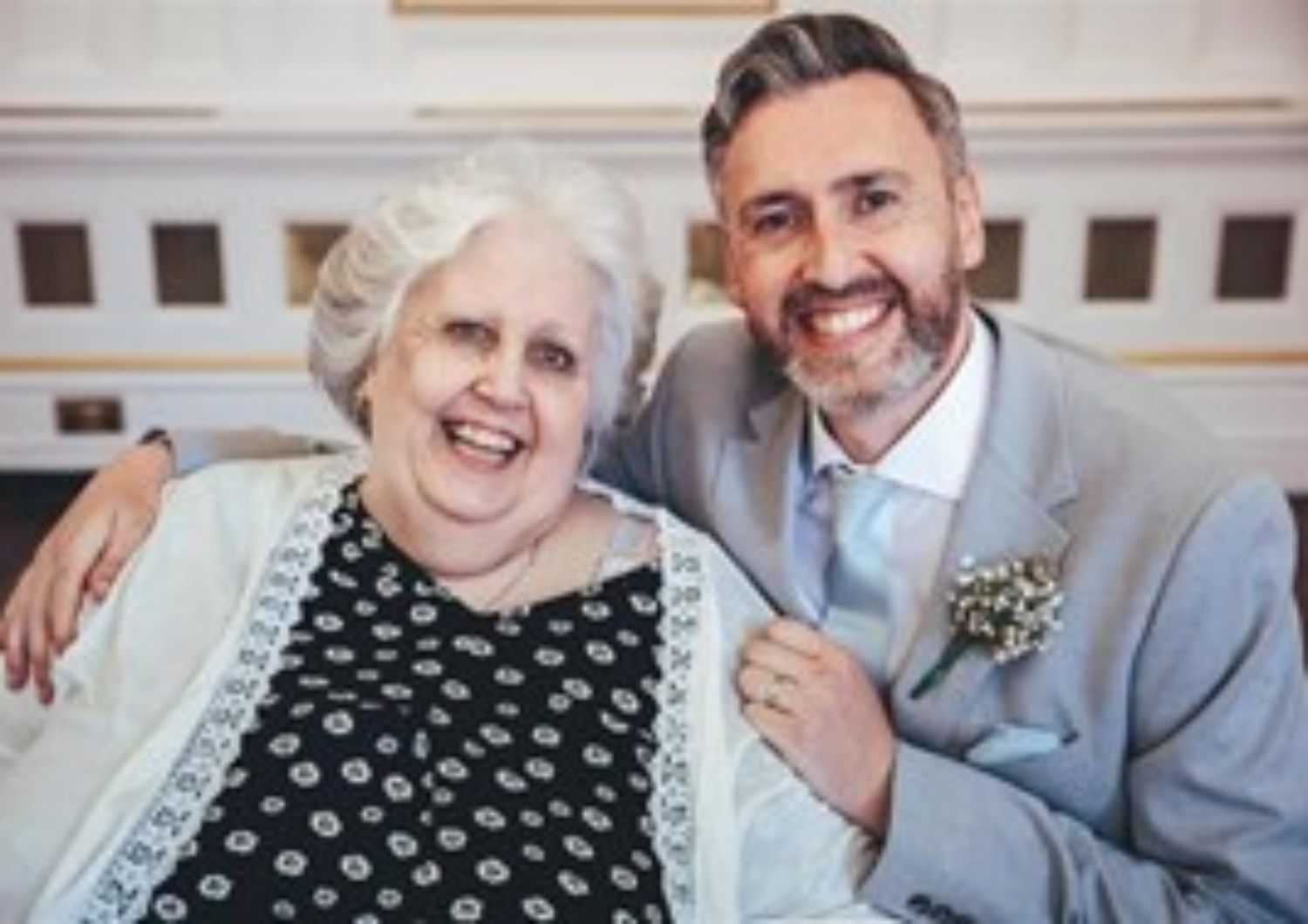 man and mum smiling at the camera